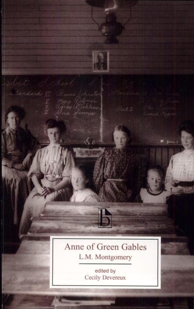 An edition of Anne of Green Gables — a sepia photograph of a one-room schoolhouse with pupils and a teacher, the title on a pale panel below.