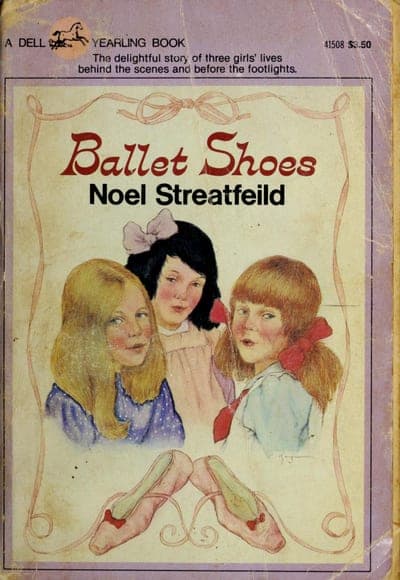 A lavender Dell Yearling paperback framed by a thin pink scrollwork border — a banner reading 'A DELL YEARLING BOOK' beside the Dell horse-and-star logo, a tagline calling it 'the delightful story of three girls' lives behind the scenes and before the footlights,' the title 'Ballet Shoes' in red script above the author's name in black capitals, a watercolor illustration of three girls' faces, and a pair of pink ballet slippers crossed at the bottom.