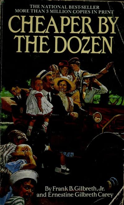 A black paperback cover banded 'THE NATIONAL BEST-SELLER — MORE THAN 3 MILLION COPIES IN PRINT,' the title 'CHEAPER BY THE DOZEN' in large cream serif capitals, a painted illustration of a large family crowded into and around an old open touring car, and 'By Frank B. Gilbreth, Jr. and Ernestine Gilbreth Carey' in white type at the bottom.