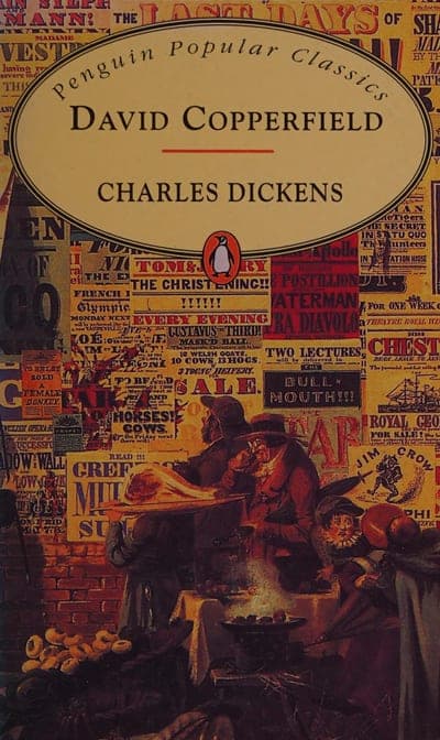 The Penguin Popular Classics paperback jacket — a busy collage of Victorian newspaper broadsheets and handbills behind a cream oval carrying the title David Copperfield and Charles Dickens in black serif type, a small red Penguin roundel above it, and a period illustration of two men at a market stall along the bottom edge.