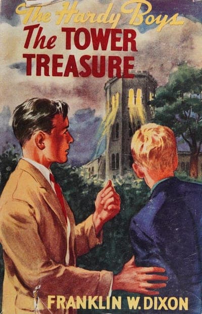 A cream and grey sky-toned cover with 'The Hardy Boys' rendered in yellow cursive script at the top, 'The TOWER TREASURE' beneath it in bold red capitals, a painted illustration of a young man in a tan suit and a boy in a navy jacket standing together with a stone tower visible behind them through the trees, and the author's name 'FRANKLIN W. DIXON' in yellow capitals along the bottom edge.