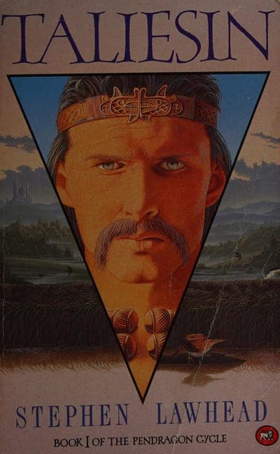 A muted rose-tan field with a large inverted black-bordered triangle framing a close-up painted portrait of a man's face with a moustache and a jewelled, patterned headband, blue eyes looking out; a hazy blue-green landscape with a distant castle shows through the triangle's upper corners, and a hand holding a small vessel appears at the triangle's point; the title runs in large purple serif capitals at the top, the author's name in purple serif capitals at the bottom, with "BOOK I OF THE PENDRAGON CYCLE" in small black type beneath it.