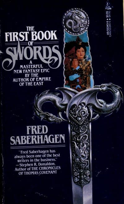 A dark blue-black Tor paperback dominated by an ornate sword hilt wound with two silver dragons, 'THE FIRST BOOK OF SWORDS' in large white serif capitals at the top beside a small circular emblem, a framed illustration of two robed figures set into the blade, and the author's name in white capitals below a tagline calling it 'A Masterful New Fantasy Epic.'