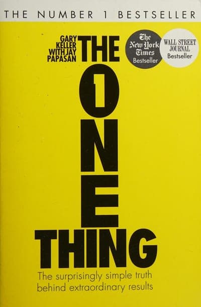 A yellow field with 'THE NUMBER 1 BESTSELLER' in a black band at top, the title 'THE ONE THING' in huge black caps with the O-N-E spelled out in blocky vertical type, NYT and Wall Street Journal bestseller seal badges at upper right, and the subtitle in small black type below the title.