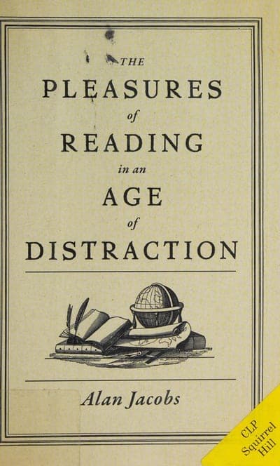 A cream/parchment field inside an ornate double-ruled border; the title set in mixed serif weights — small italic 'THE', large capitals 'PLEASURES', small italic 'of', large capitals 'AGE', small italic 'in an', large capitals 'DISTRACTION' — above a horizontal rule, a small line-drawn illustration of an open book, a quill pen, and a globe resting on a table, then a second rule and the author's name 'Alan Jacobs' in italics.