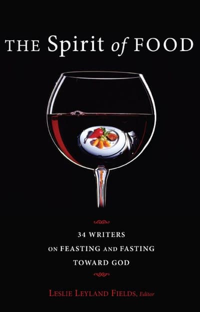 A black jacket centered on a large wine-filled glass goblet holding a small white plate of food behind its bowl, red ornamental flourishes above and below the subtitle, the title in white serif type with 'Spirit' and 'of' italicized, and the editor's name in red italics at the foot.